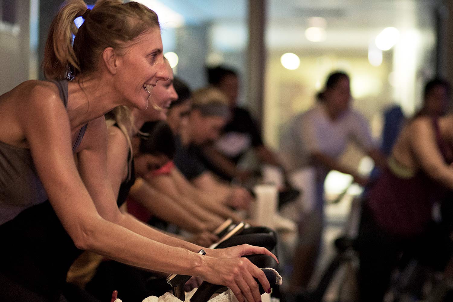 Women taking a spin cycling class.