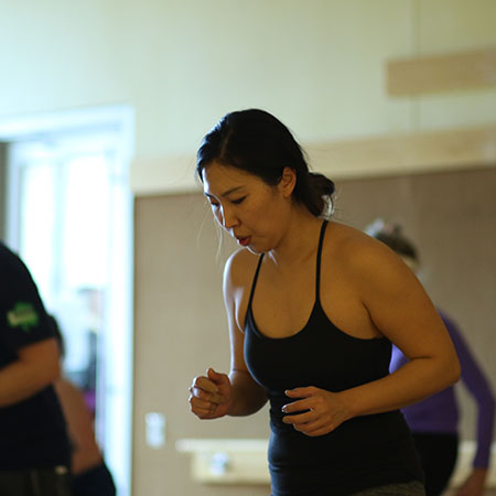 Woman in a group fitness class.