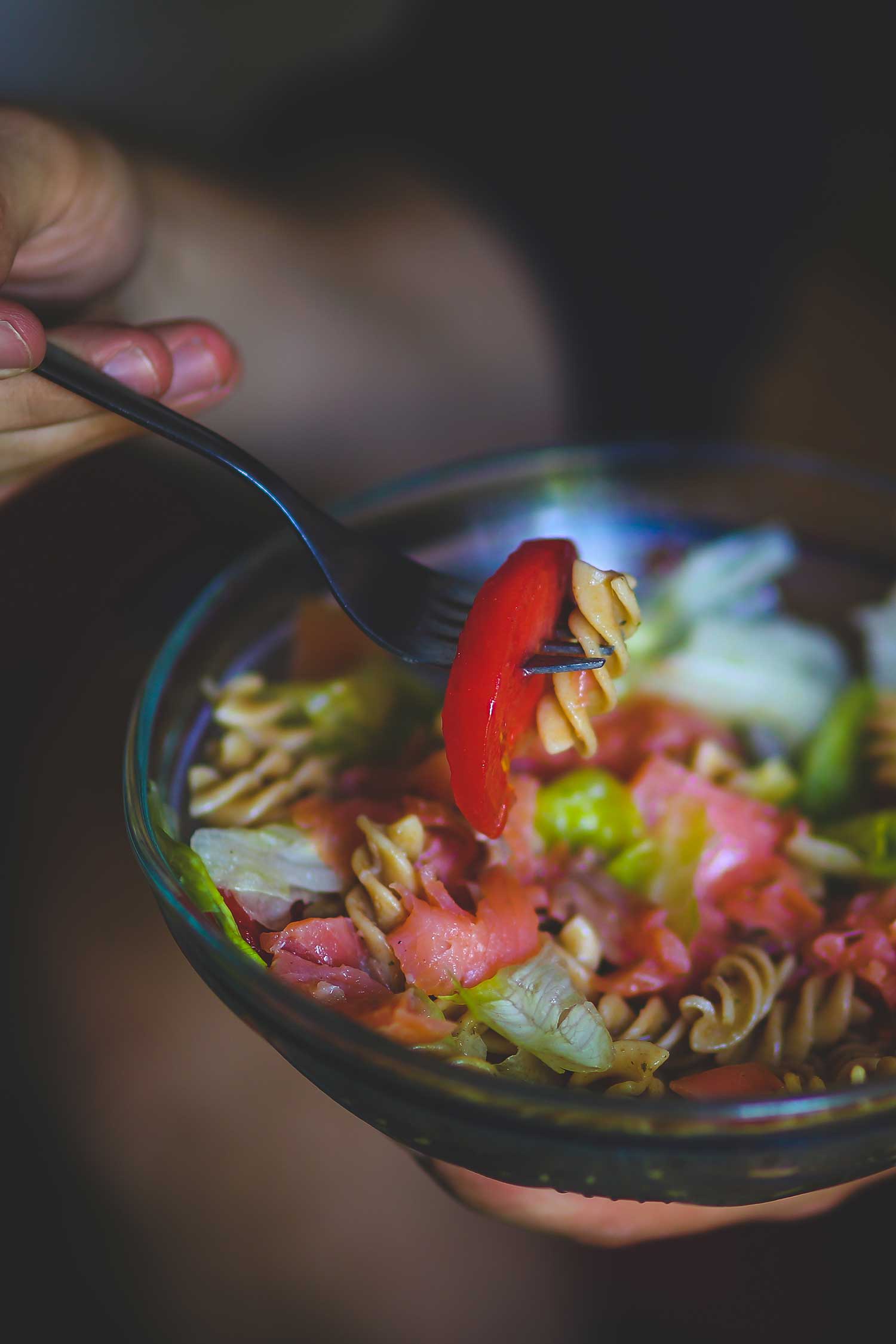 Woman eating a bowl of pasta. FFC Chicago Dietitian Nutritionist.