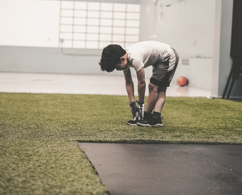 male child working out at the gym