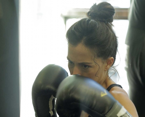 Woman with boxing gloves on