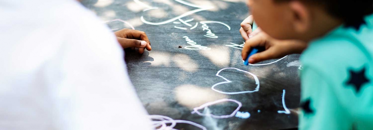 Kids drawing with chalk