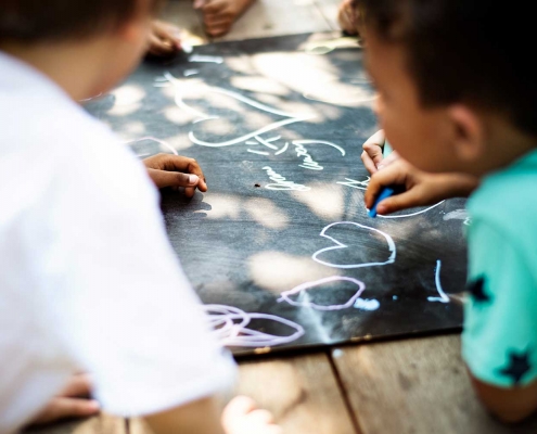 Kids drawing with chalk