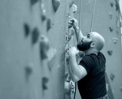 Man climbing FFC wall.