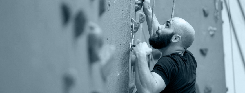 Man climbing FFC wall.