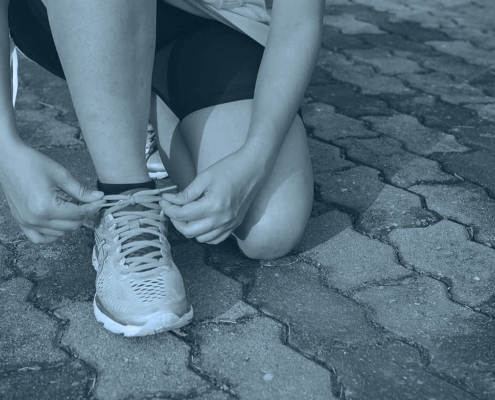 Runner tying shoelaces.