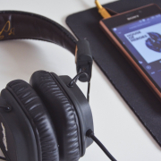 Headphones and iPhone playing a playlist