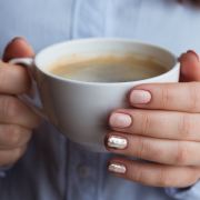 Woman's hands holding coffee mug