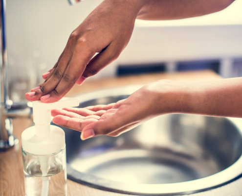 Woman washing hands at sick