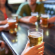 Image of friends drinking beer together in a bar.