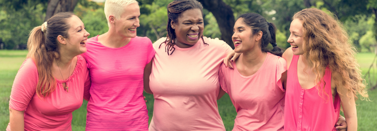 Group of diverse women wearing pink