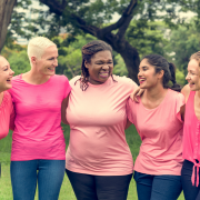 Group of diverse women wearing pink