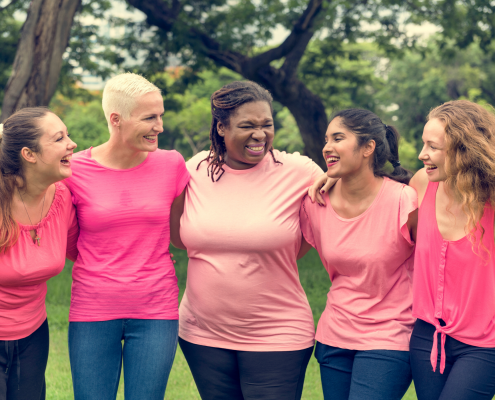 Group of diverse women wearing pink