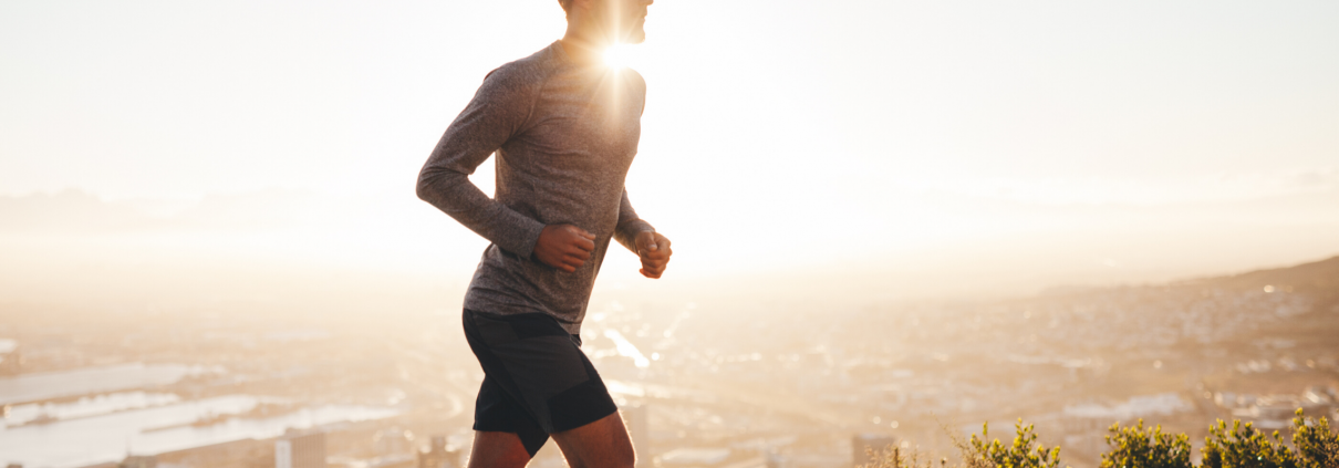 Man running outside in the sunshine