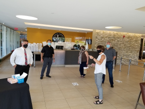 Group of people talking at the FFC Park Ridge reopening