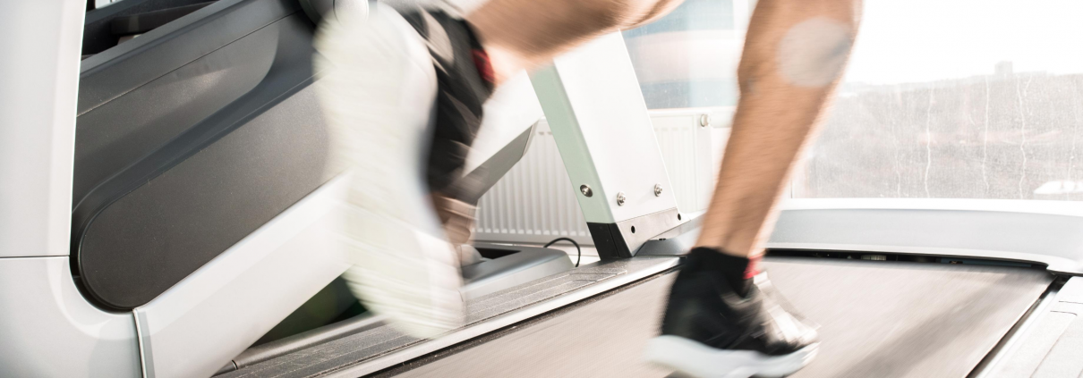 man running on treadmill