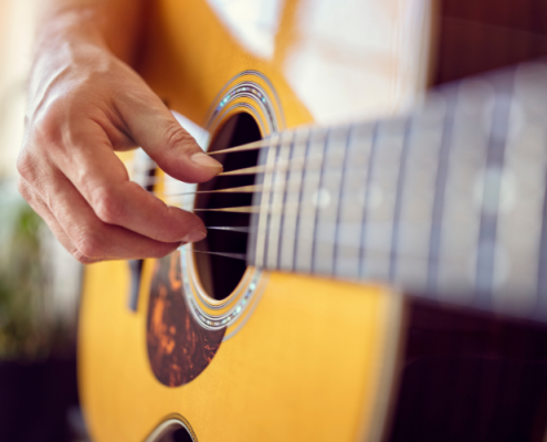 Closeup Photo of Acoustic Guitar