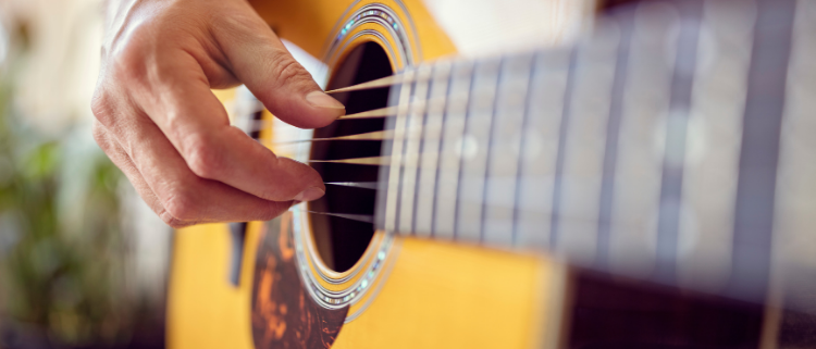 Closeup Photo of Acoustic Guitar