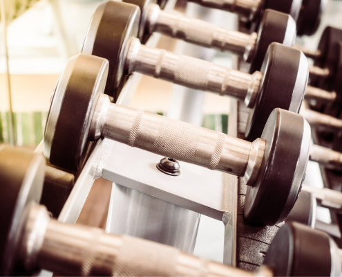Photo of dumbbells on a weight rack