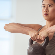 Woman lifting heavy kettlebell