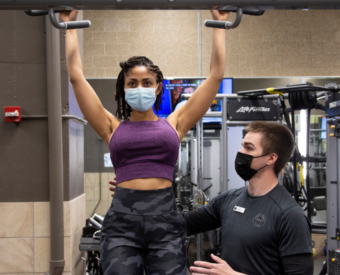 Krys Rollins performing a pull up