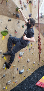 Sam on the rock climbing wall