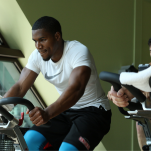 Man on a spin bike in an Iron Ride group fitness class in Chicago