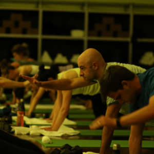 Men and women doing yoga in a Red Hot group fitness class in Chicago