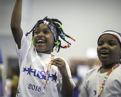 Photo of two young girls smiling and having fun