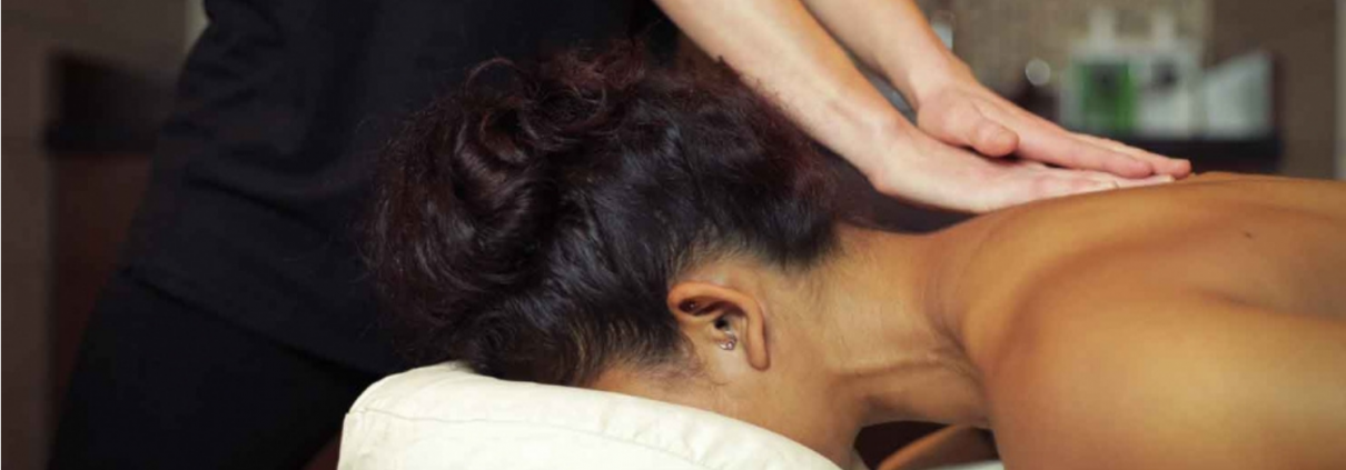Woman laying face down on massage table