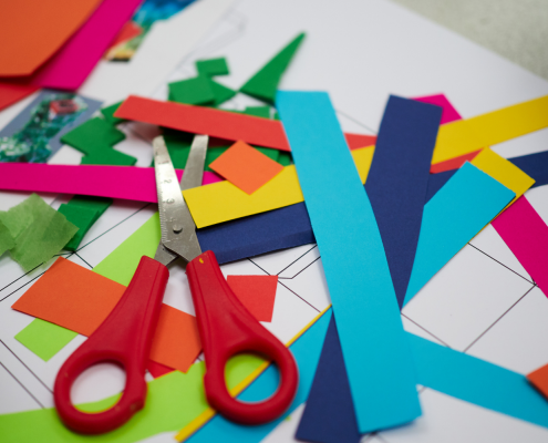 Collection of kids crafting supplies on a table.