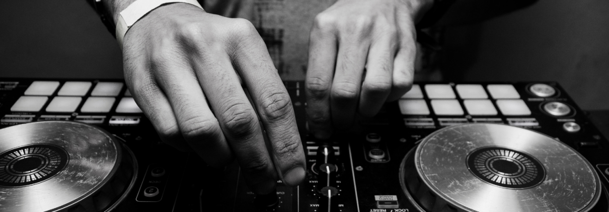 A pair of hand using DJ equipment