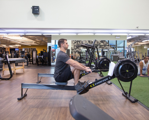 Man on rowing machine at the gym