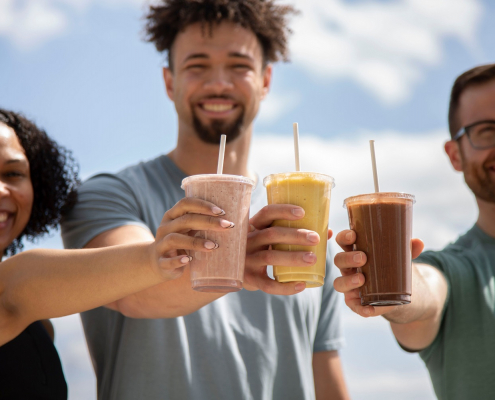 Three FFC employees drinking smoothies