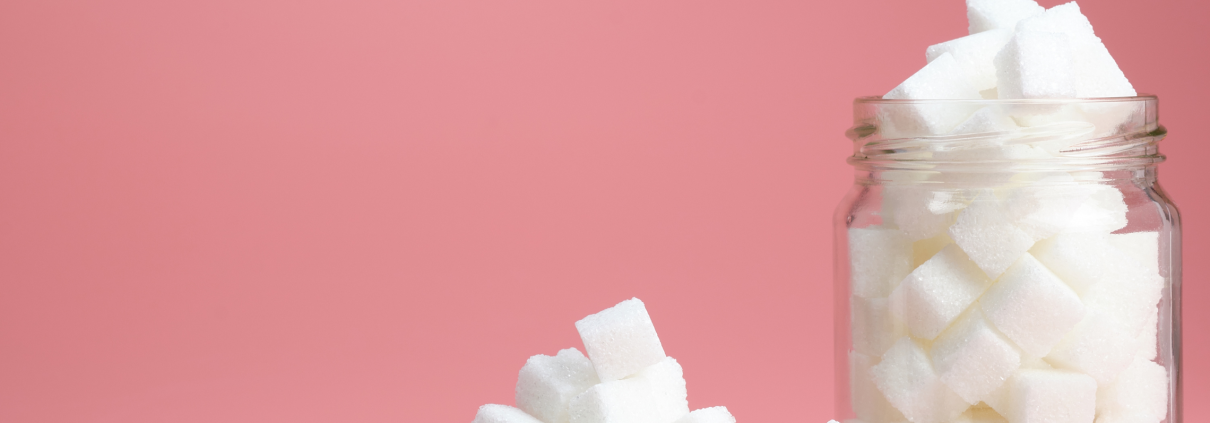 Sugar cubes on a pink background