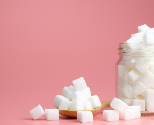 Sugar cubes on a pink background