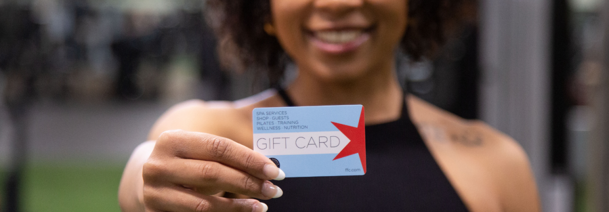 Woman holding a FFC gift card