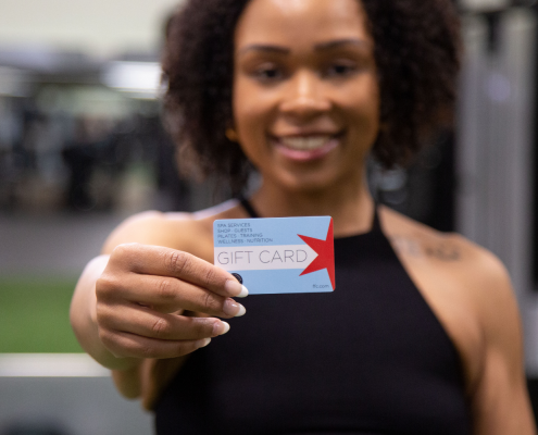 Woman holding a FFC gift card