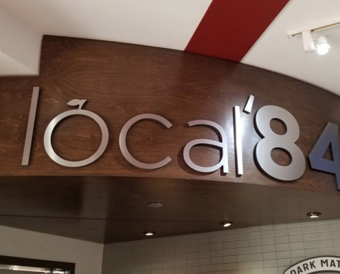 Image of local'84 cafe logo in a cafe