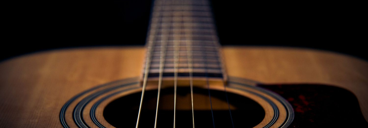 A guitar highlighting the strings
