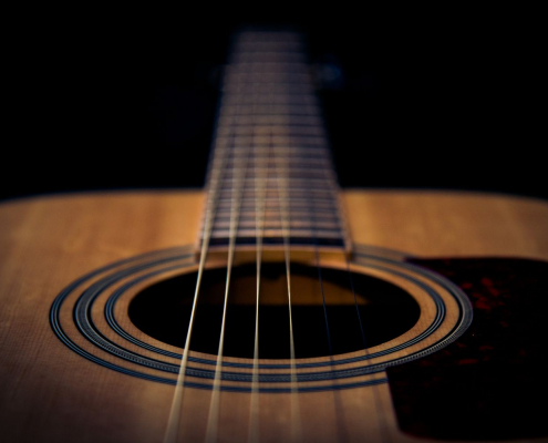 A guitar highlighting the strings