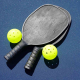 a picture of pickleball rackets on a pickleball court