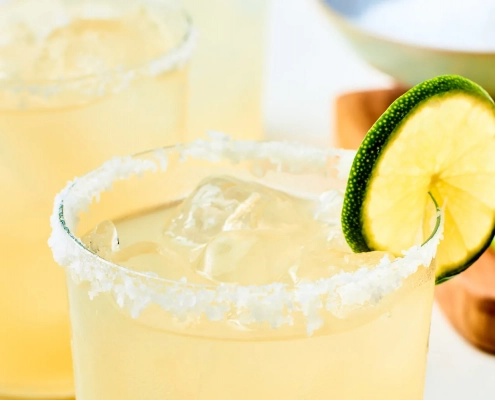 A margarita with a lime and salt on the rim