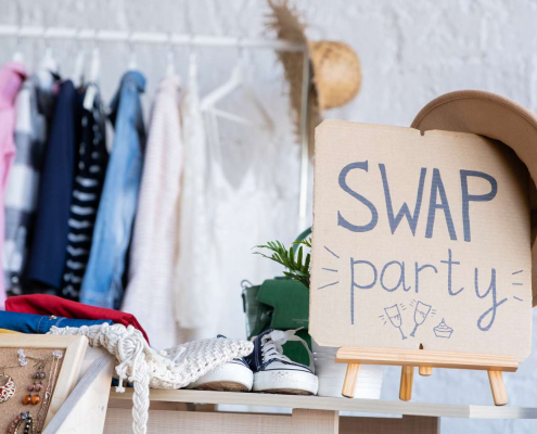 Swap party event with clothes in the background