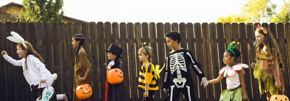 a group of children trick or treating during Halloween