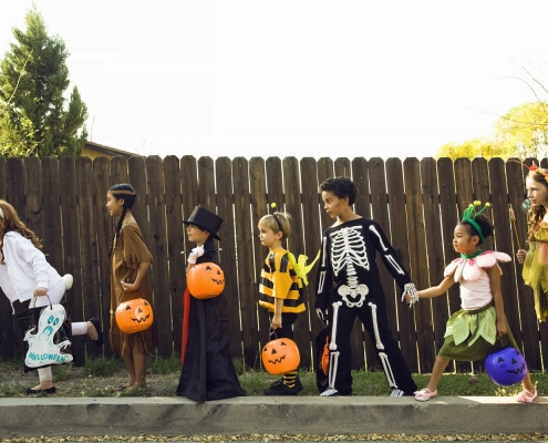 a group of children trick or treating during Halloween