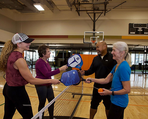 members playing pickleball at EH