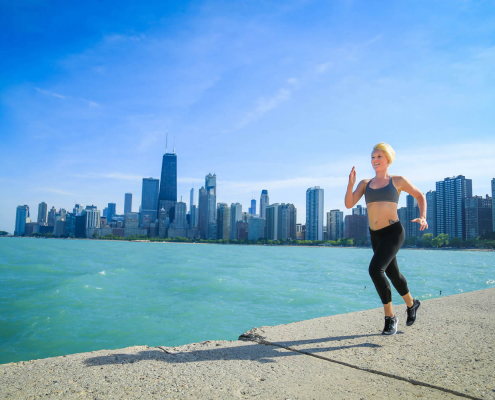 A women running on the Chicago lakefront trail