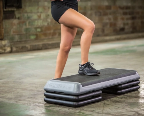 A women doing a step class