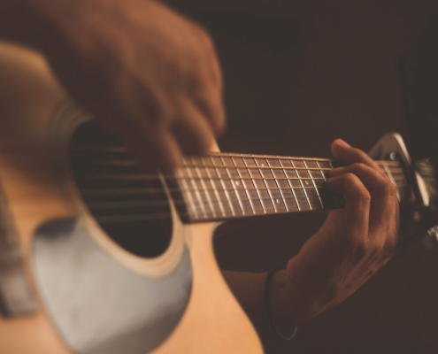 A person playing the guitar